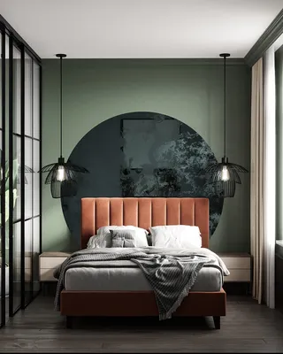 Интерьер спальни и гостиной с зелеными стенами и терракотовыми кроватью и  диваном SKDESIGN