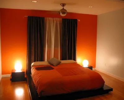 Фото дизайна спальни в оранжевых тонах